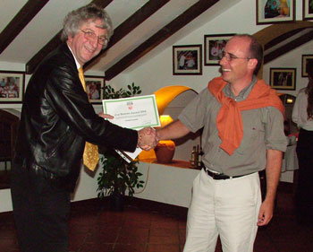 ERCIM President Keith Jeffery (left) presents the Cor Baayen Award to Christof Teuscher.